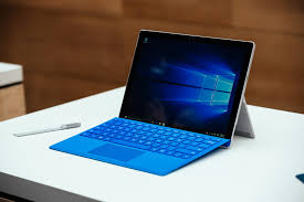 Surface laptop sitting open on desk.